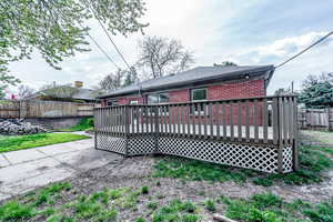 Rear view of property with a deck