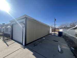 View of side of home with a garage