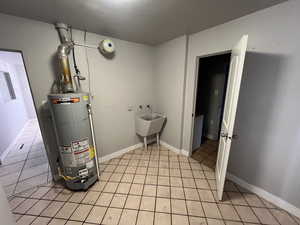 Utilities with sink and gas water heater