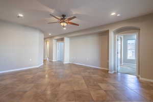 Living Room with tile floors and ceiling fan