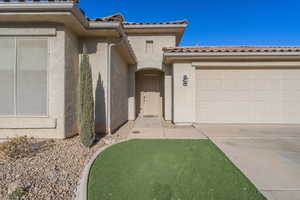 Entrance to property with a garage