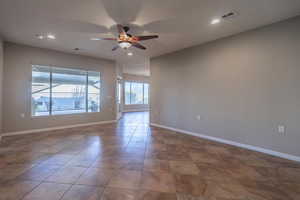 Living room featuring ceiling fan and light tile patterned floors