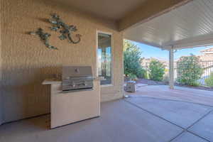 View of patio / terrace featuring area for grilling, built in BBQ, and a mountain view