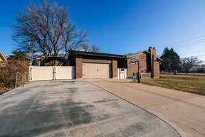 View of side of home featuring a garage