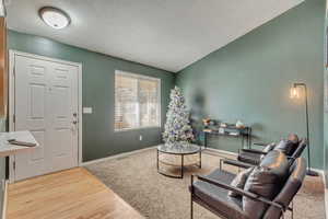 Sitting room with light wood-type flooring