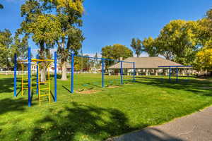 View of play area featuring a yard