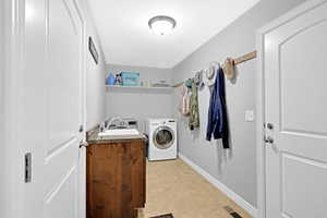 Clothes washing area with independent washer and dryer and sink