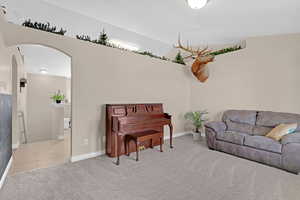 Sitting room with light colored carpet