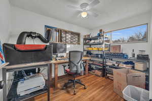 Office area featuring ceiling fan and hardwood / wood-style flooring