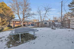 View of yard covered in snow