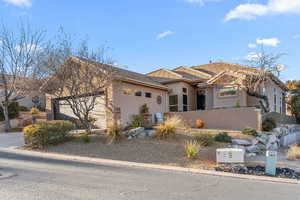 View of front of property featuring a garage