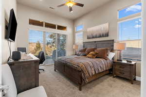 Primary Bedroom with large windows and covered patio access.