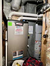 Utility room featuring water heater