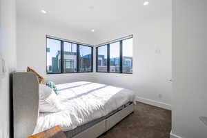 Bedroom with dark carpet