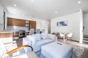 Living room featuring sink and light wood-type flooring