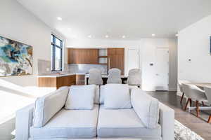 Living room featuring sink and hardwood / wood-style flooring