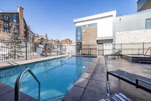 View of swimming pool with a patio area