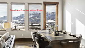 Dining room with a mountain view and hardwood / wood-style floors