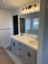 Bathroom featuring a tub, a textured ceiling, and vanity