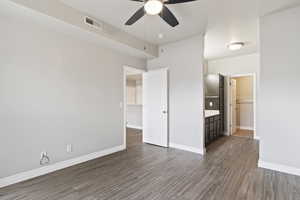 Unfurnished bedroom featuring hardwood / wood-style flooring and ceiling fan