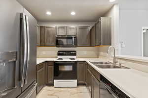 Kitchen with stainless steel appliances and sink