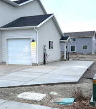 View of side of home with a garage