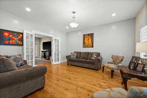 Living room featuring light hardwood / wood-style flooring and french doors