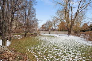 View of yard layered in snow