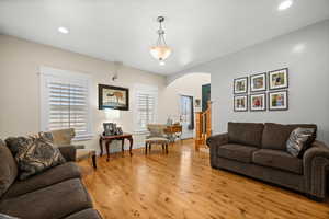 Living room with light hardwood / wood-style flooring