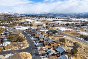 Snowy aerial view featuring a mountain view