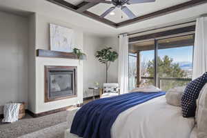 Carpeted bedroom with ceiling fan