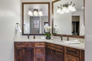 Bathroom featuring vanity and a shower with shower door