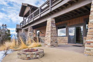 Exterior space with a balcony and a patio