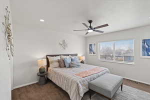 Bedroom with ceiling fan and carpet flooring