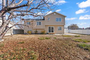 Back of house with a patio area