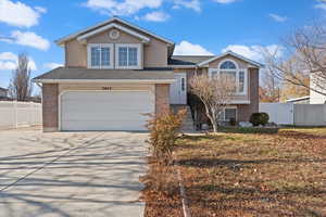 View of front facade featuring a garage