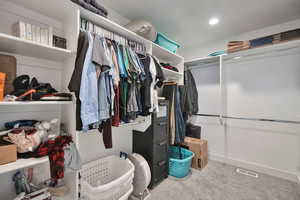 Walk in closet featuring carpet