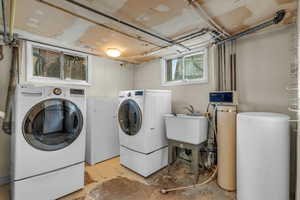 Clothes washing area with separate washer and dryer and sink