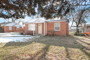 View of front of property with a front yard