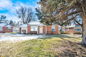 View of front of property with a front lawn