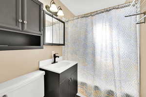 Bathroom featuring toilet and vanity