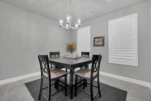 Dining space with a chandelier