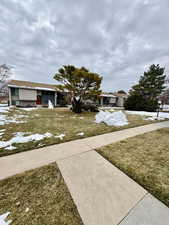 View of front of home featuring a front lawn