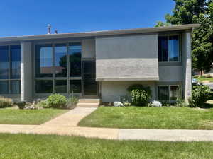 View of front of house with a front yard