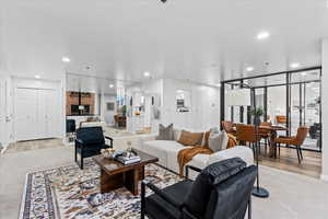 Living room with light hardwood / wood-style flooring