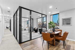 Dining area featuring expansive windows and light wood-type flooring