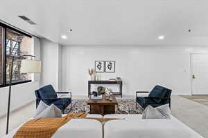 Sitting room featuring a wealth of natural light