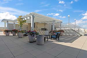 View of patio / terrace featuring exterior kitchen and a pergola