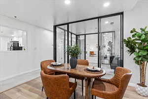 Dining room with light hardwood / wood-style floors