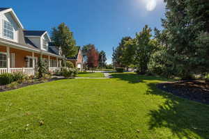 View of yard featuring covered porch